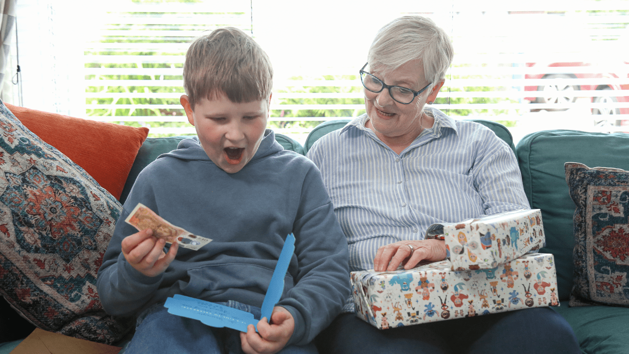 boy excited about receiving birthday money